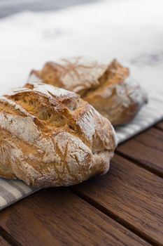 Extreme clos-up of rustic Italian bread, isolated on background out of focus.