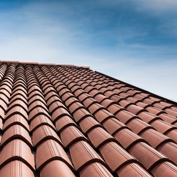 Vertical view of a tiled roof brown.