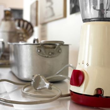 Vintage mixer in an old kitchen, italian accessories of the sixties.