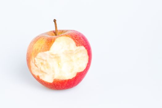 Red Delicious Apple on White Background. Missing a bite.