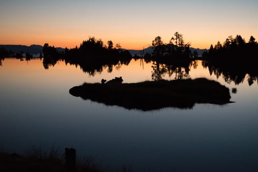 Sunrise lake in the Spanish Pyrenees, located at mountain hut JM Blanc, Aigüestortes i Estany de Sant Maurici national park