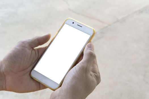 Closeup of men's hands, businessman holding a smartphone with a clean white screen and a white screen with a mockup design, stay outdoors to play social media or check stock, along with the vivid visual style on the street background.