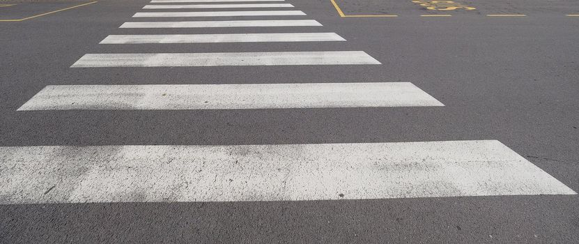 Warning signs, zebra crossing traffic sign painted on street tarmac