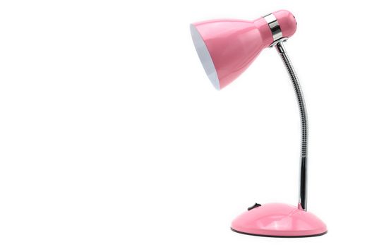 Pink colored table lamp on a white isolated background