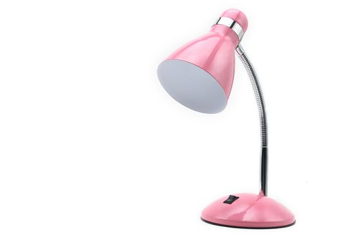 Pink colored table lamp on a white isolated background