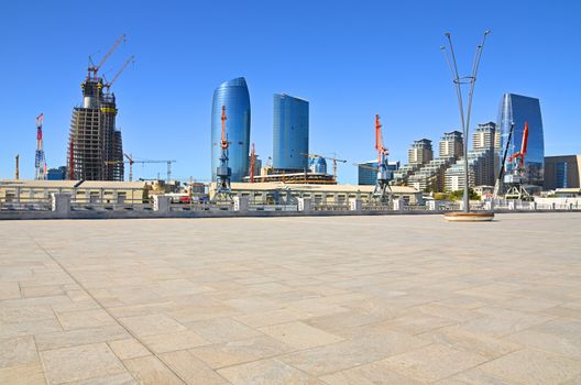 Views on parts of the city and architecture from the shores of the Caspian Sea in Baku.Port of Baku and buildings under construction.Azerbaijan