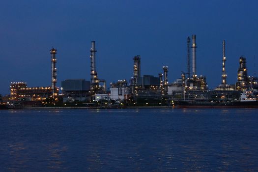 Twilight at petrochemical oil refinery factory