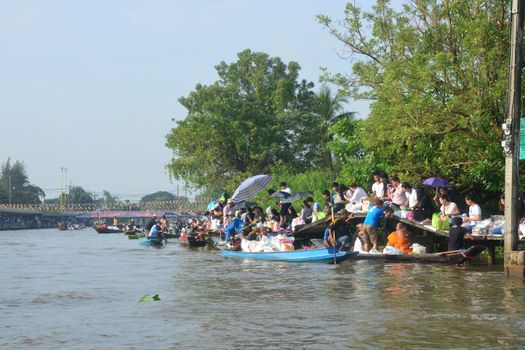 BANGKOK, THAILAND – OCTOBER 8, 2017 : Tuk baat Phra Roi River Festival (Give alms to a Buddhist monk on boat) On the Lamplatiew Canal in front of Wat Sutthaphot, Lat Krabang District Bangkok