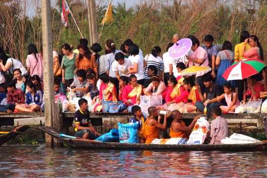 BANGKOK, THAILAND – OCTOBER 8, 2017 : Tuk baat Phra Roi River Festival (Give alms to a Buddhist monk on boat) On the Lamplatiew Canal in front of Wat Sutthaphot, Lat Krabang District Bangkok

