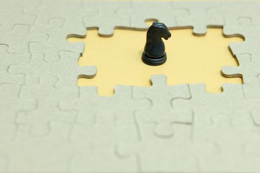 Business strategy conceptual photo - horse knight standing in front of jigsaw piece puzzle