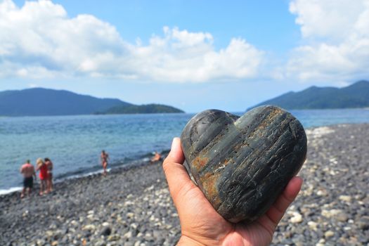 Heart shaped stone in hand,  Koh Hin Ngam , Tarutao Marine National Park in Satun Province, Thailand

