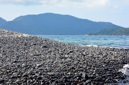 Koh Hin Ngam  is a unique small island unlike other island. It's covered with small black rocks in Tarutao Marine National Park in Satun Province, Thailand