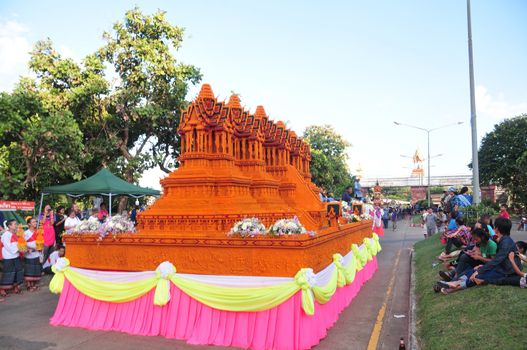 Sakon nakhon ,Thailand – October 23,2018 : Wax Castle Festival is held annually at the end of the Buddhist Lent. The event are objective to pay homage to Phra That Choeng Chum