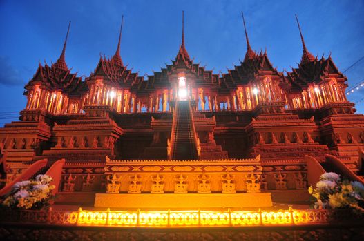 Sakon nakhon ,Thailand – October 23,2018 : Wax Castle Festival is held annually at the end of the Buddhist Lent. The event are objective to pay homage to Phra That Choeng Chum