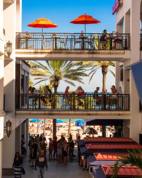 An Outdoor Shopping Mall in a Tropical Location With Three Floors