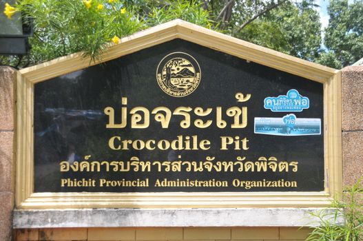 PHICHIT, THAILAND – 1 OCTOBER 2019 : label character of  Crocodile pit phichit provincial administration organization at Bueng Si Fai public park