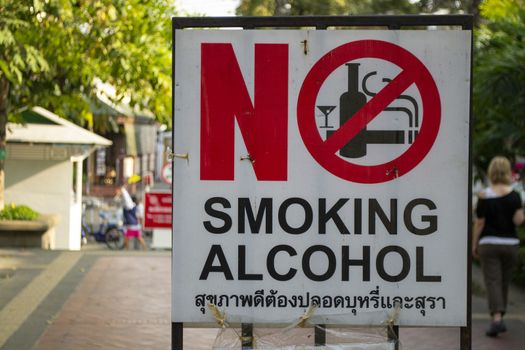 Bagnkok, Thailand, December 2011: No smoking no alcohol sign in the streets of Bangkok, written in English and Thai languae. Warning sign.