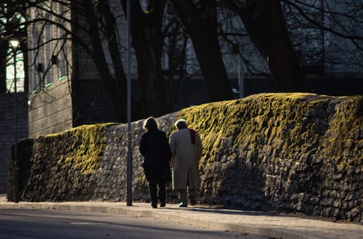 April 19, 2018, Tallinn, Estonia. Passers-by on the street of the Old city in Tallinn.
