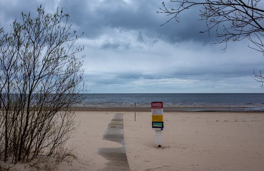 April 25, 2018 Jurmala, Latvia. Wooden walkway on the sandy beach of the Baltic Sea in Jurmala.