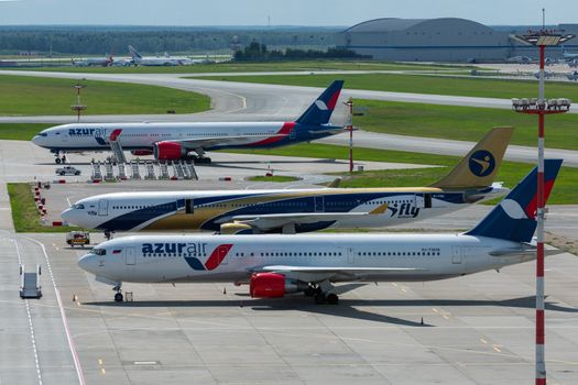 July 2, 2019, Moscow, Russia. Airplanes Boeing 767-300 Azur Air airline and Airbus A330-300 I Fly Airlines at Vnukovo airport in Moscow.