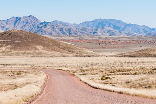 Road and mountain landscape on road C27 in the Namibrand area