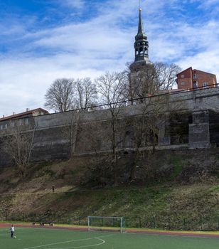 April 21, 2018 Tallinn, Estonia. Football field at the fortress wall of the Old city in Tallinn