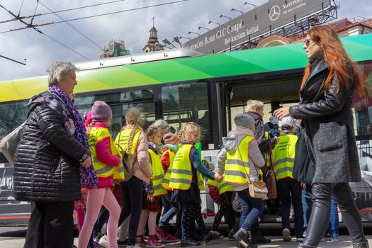 April 27, 2018 Vilnius, Lithuania, Schoolchildren in reflective vests at a bus stop in Vilnius.