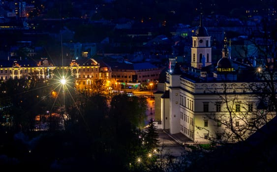 April 27, 2018 Vilnius, Lithuania. View of the old city of Vilnius from Three Cross Mountain at night.