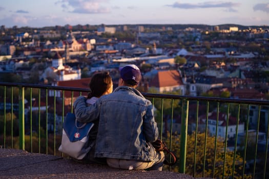 April 27, 2018 Vilnius, Lithuania. Lovers enjoy the view of the old city on the Three Crosses Hill in Vilnius.