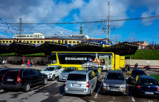April 26, 2018 Riga, Latvia. Yellow passenger bus of the Ecolines company at the bus station in Riga.
