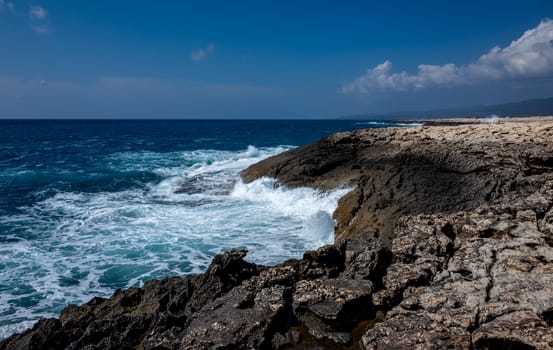 Waves crash on the rocky shore of the Mediterranean Sea on the Akamas Peninsula in the northwest of the island of Cyprus.