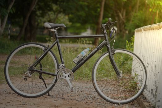 The bike parked next to the training ground in the morning to prepare for the cycling practice.