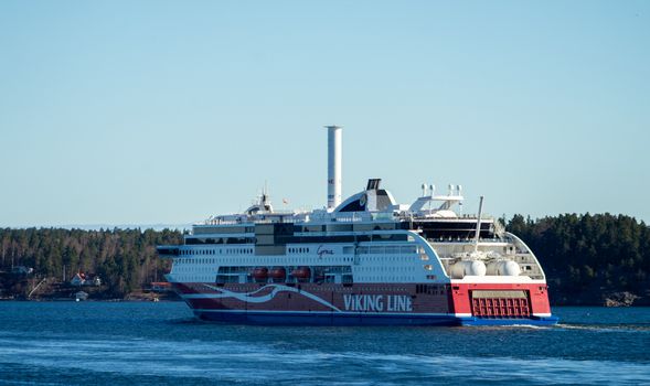 22 April 2019, Stockholm, Sweden. High-speed passenger and car ferry of the Finnish shipping concern Viking Line Viking Grace equipped with rotary sail in Stockholm skerries.