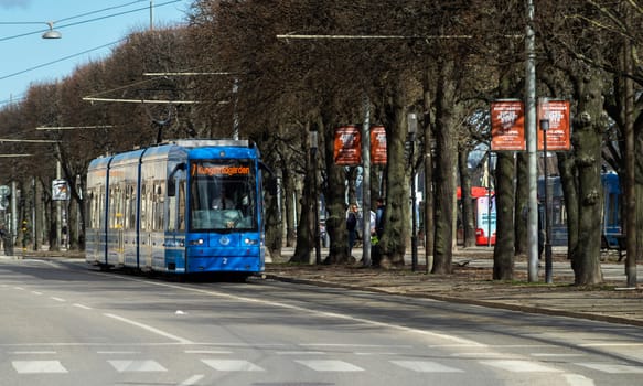 April 22, 2018, Stockholm, Sweden. Blue tram on one of the streets of Stockholm in spring clear weather.