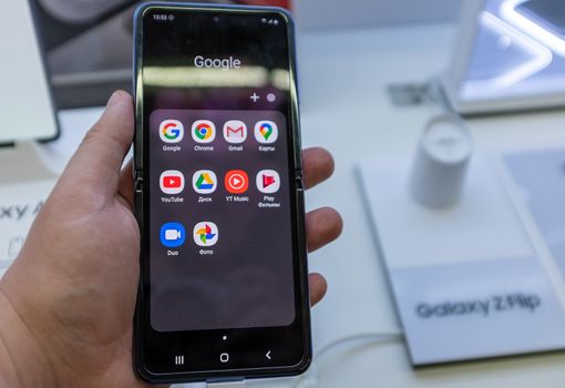 February 22, 2020, Moscow, Russia. New folding smartphone with a folding screen Samsung Galaxy Z Flip on the store counter.