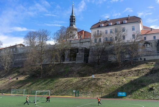 April 21, 2018 Tallinn, Estonia. Football field at the fortress wall of the Old city in Tallinn