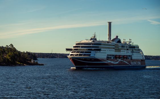 22 April 2019, Stockholm, Sweden. High-speed passenger and car ferry of the Finnish shipping concern Viking Line Viking Grace equipped with rotary sail in Stockholm skerries.