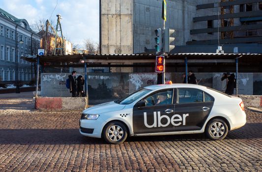 February 19, 2019, Moscow, Russia. Taxi company Uber on the cobblestones of a pedestrian crossing in Moscow.