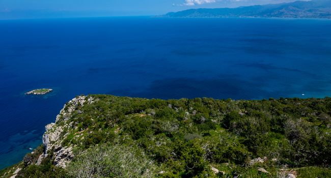 Green mountainous coast of the Mediterranean Sea on the Akamas Peninsula in the northwest of the island of Cyprus.