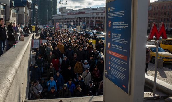 April 1, 2019 Moscow, Russia. A crowd of passengers descend into the metro during the morning rush hour on the square of Three stations in Moscow.