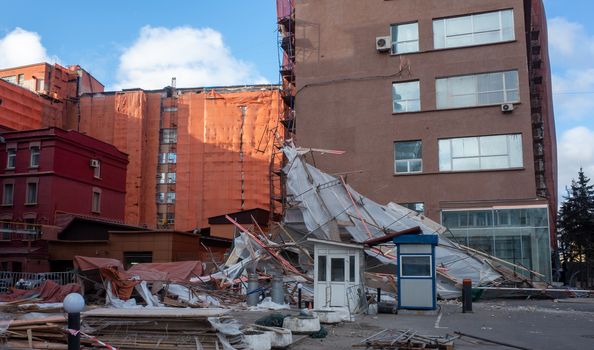 Scaffolding collapsed from a strong wind near a reconstructed multi-storey building in the city center.