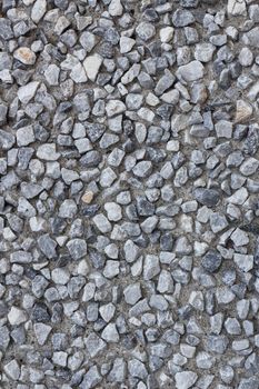 Hard surface of small pebble concrete. Texture with a lot of small stones for your background.