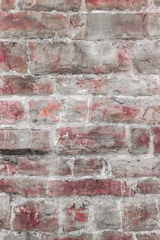 Red stone wall pattern. Close up of big concrete bricks outside.