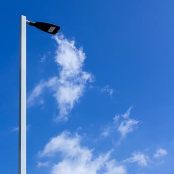 Street lamp with blue sky background.