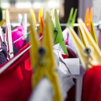 Clothes pegs on washing line. Extreme close-up. Defocused blurry background.