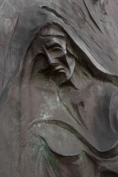 Sculpture depicting Death, in an Italian cemetery.