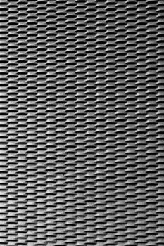 Texture of a grate in aluminum, with repeating pattern.