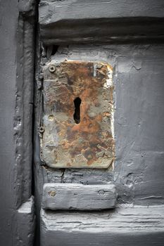 Extreme close-up of rusty lock of a door.