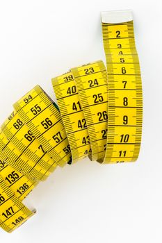 Top view of a tailor meter, isolated on white background.