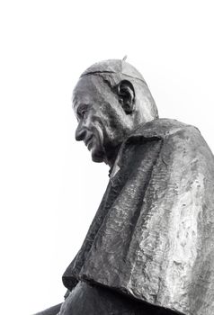 Statue of Pope John XIII against white sky with copy space